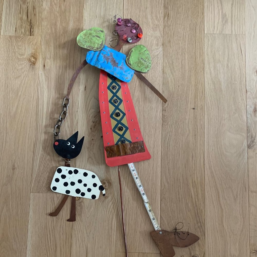 Primitive Rustic style, this ~32 inch tall “Mara and dog” metal wall art